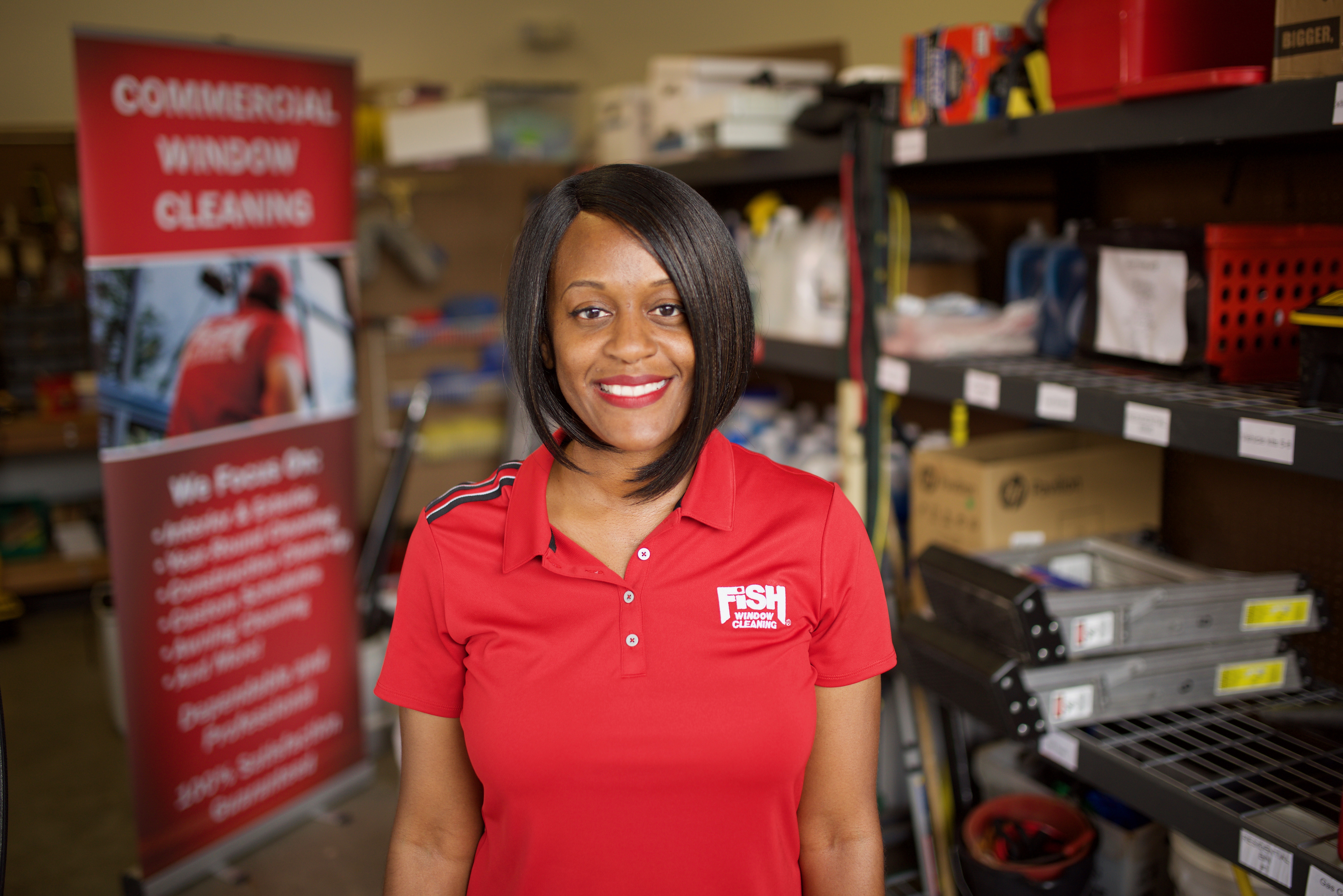 Image of Fish Window Cleaning Franchise Owner in Front of Equipment and Banner